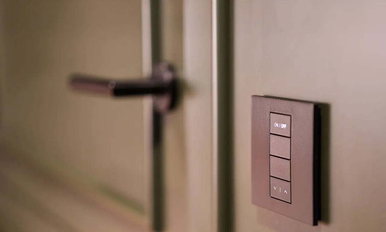 Smart switch installed in a wall next to the door